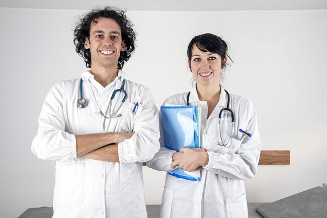 portrait of a young female doctor and a young male doctor