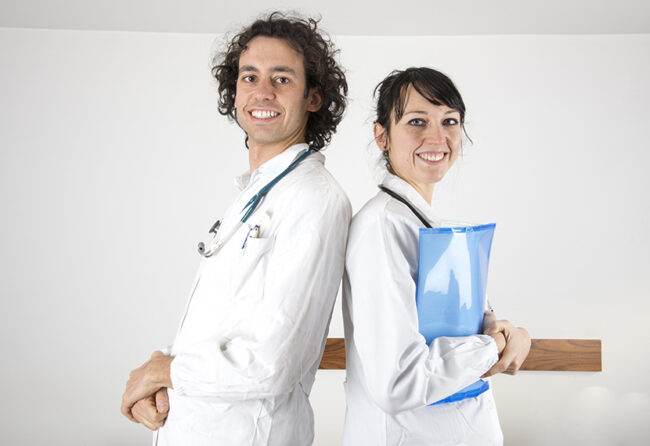 portrait of a young female doctor and a young male doctor