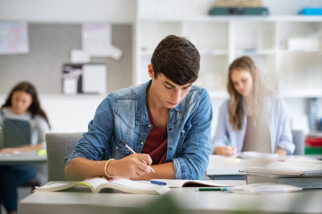 Teen student studying in classroom